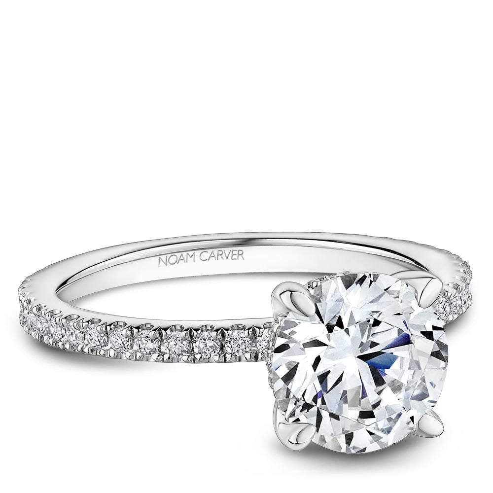 White gold ring with round diamond accents.