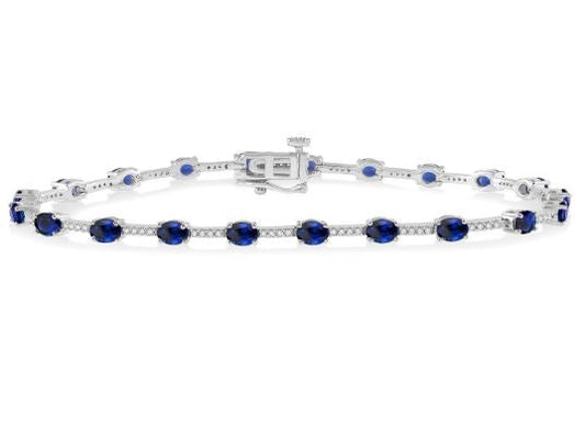 Oval sapphire and diamond station bracelet.