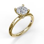Yellow gold ring with solitaire diamond setting.