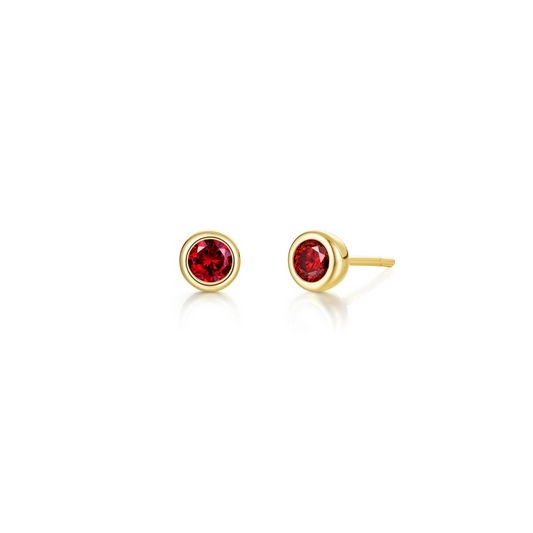 Yellow silver earrings with round red garnets.