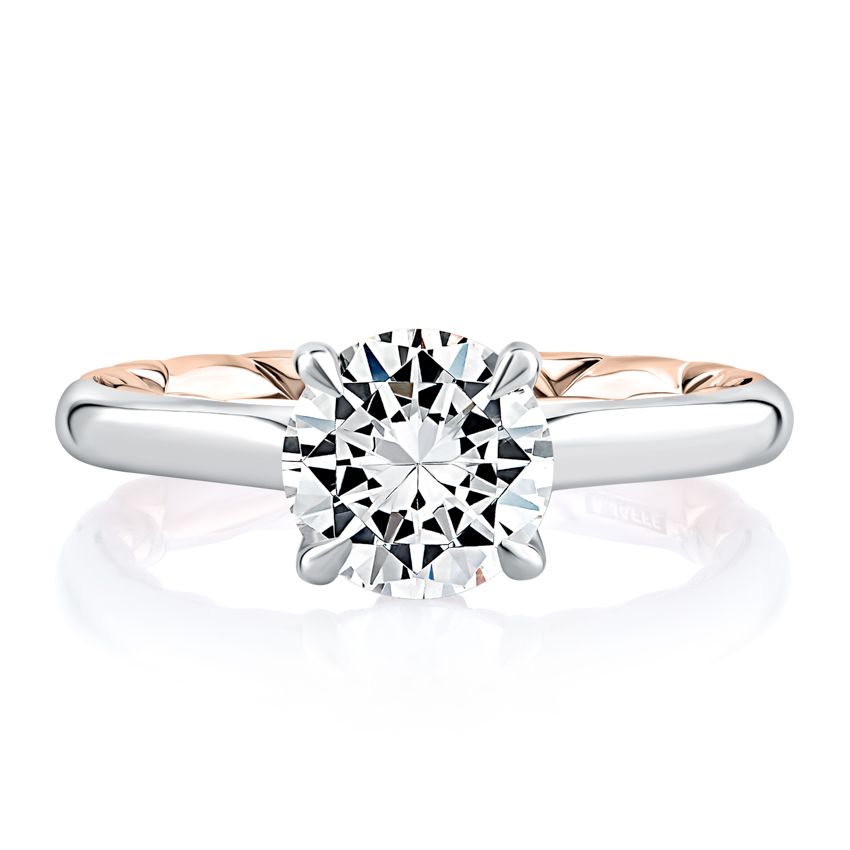 White rose gold ring with round diamond.