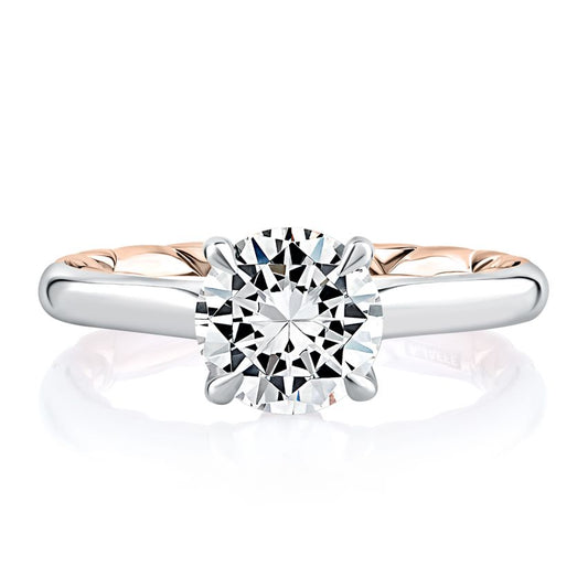 White rose gold ring with round diamond.