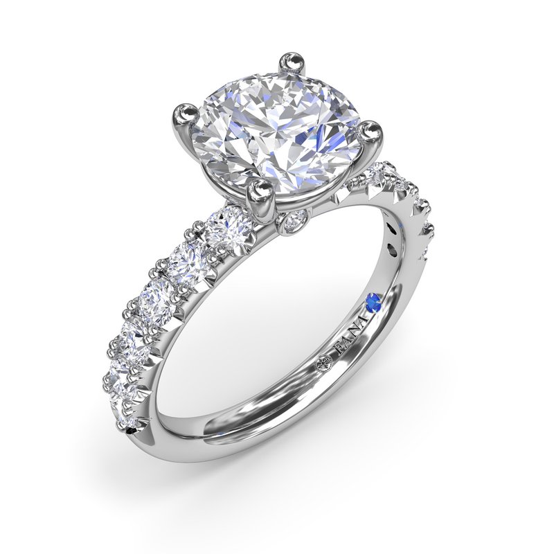 14K white gold ring with emerald diamonds.