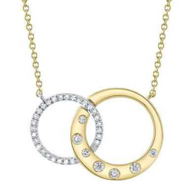 Two-tone gold necklace with diamond circles.