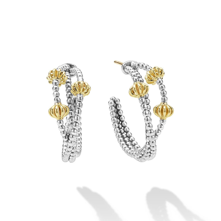 Sterling silver hoops with gold accents.