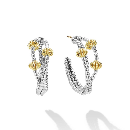 Sterling silver hoops with gold accents.