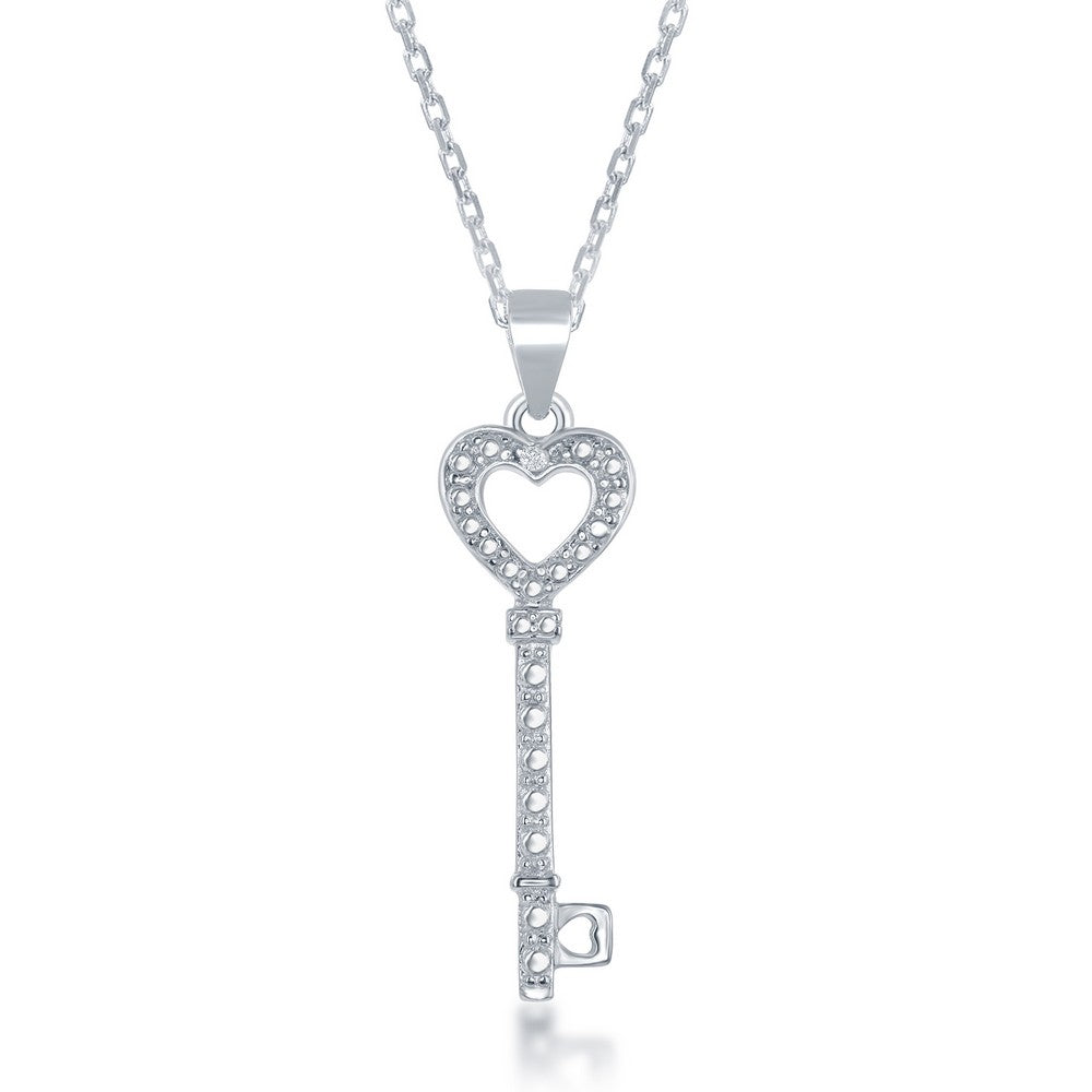 Heart-shaped key pendant with diamond accents.