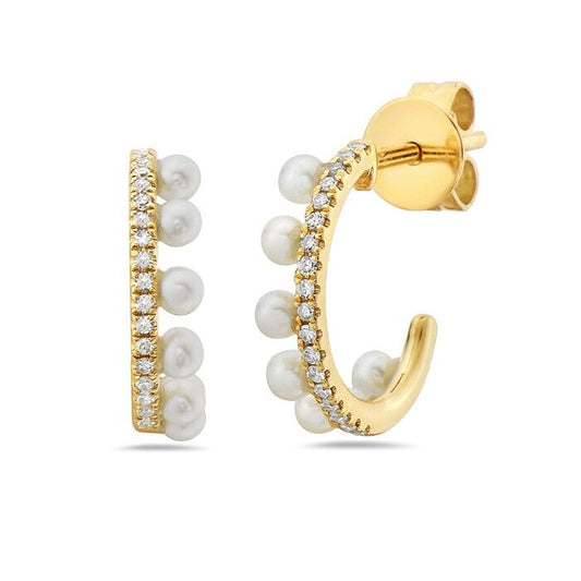 Yellow gold hoops with pearls and diamonds.