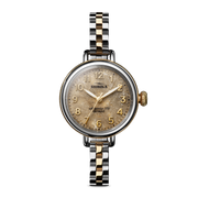 Two-tone stainless steel watch with tan dial.