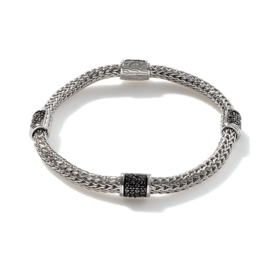 Sterling silver bracelet with black sapphire accents.
