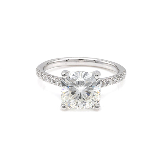 Cushion diamond ring with side stones.