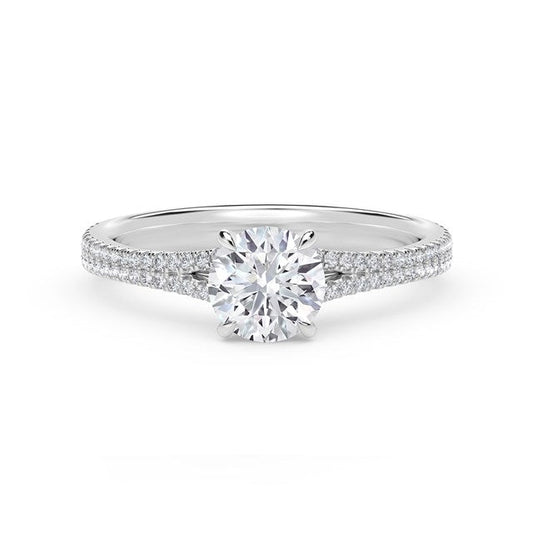 Platinum ring with round diamond and side stones.