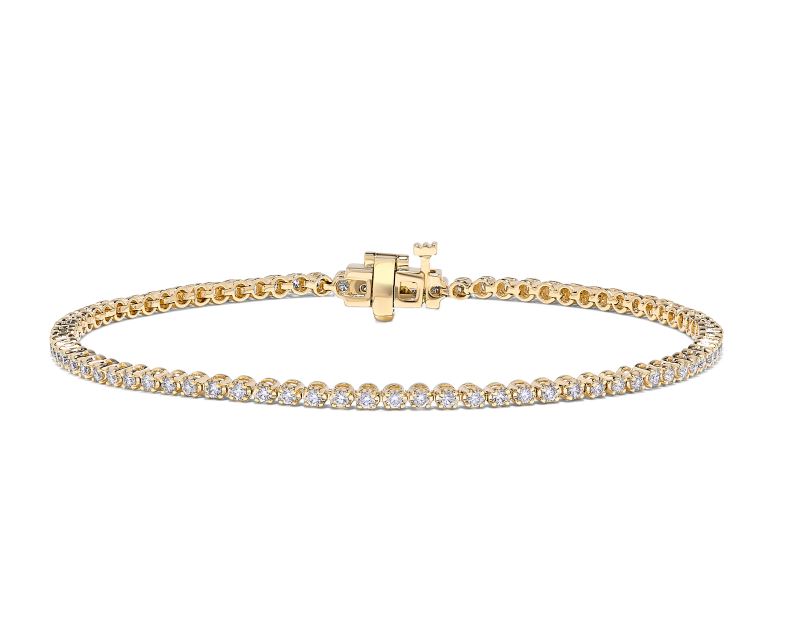 14K yellow gold diamond tennis bracelet.