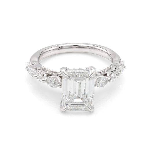 Emerald-cut diamond ring with side stones.