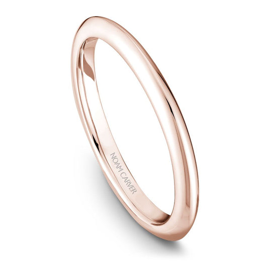 Polished rose gold carved band ring.