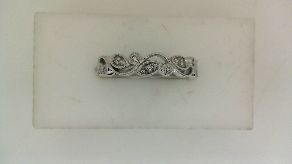 14K white gold band with intricate diamond design.