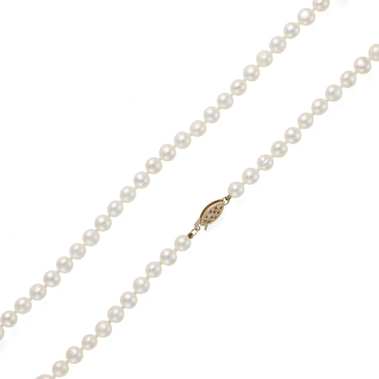 Pearl strand necklace with gold plunger clasp.