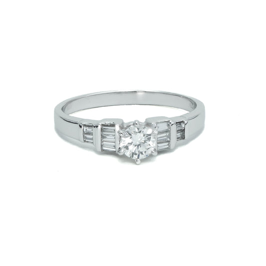 Platinum ring with round and baguette diamonds.
