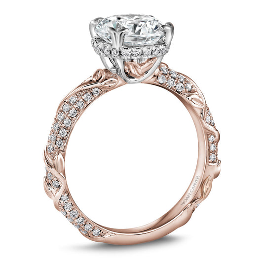 Rose gold ring with intricate diamond detailing.