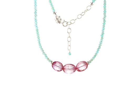 Turquoise bead necklace with pink gemstones.
