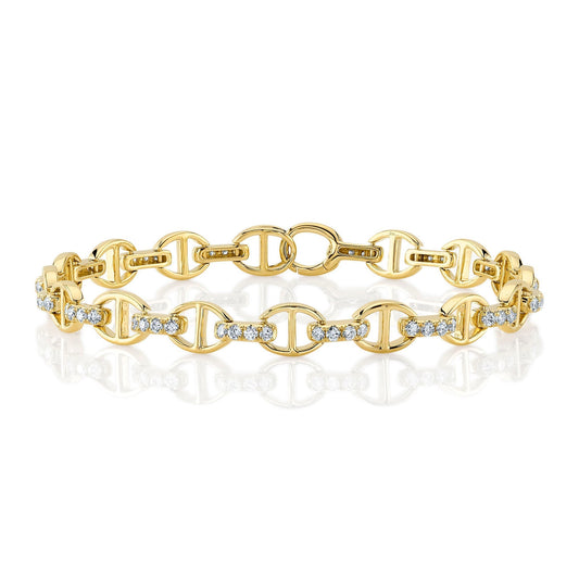Yellow gold bracelet with diamond accents.