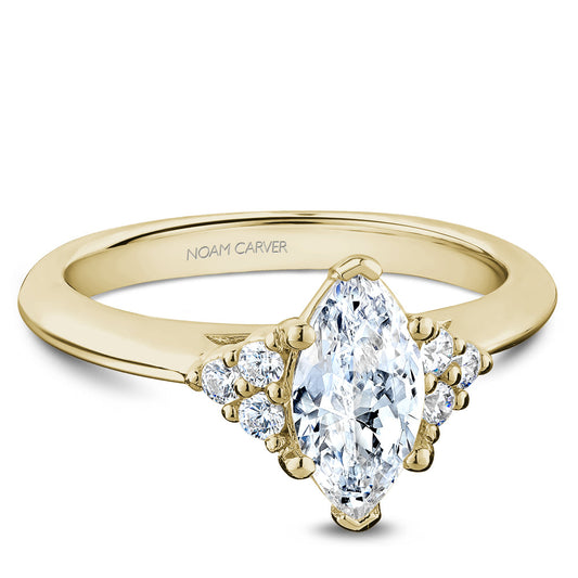 Yellow gold ring with marquise and side diamonds.