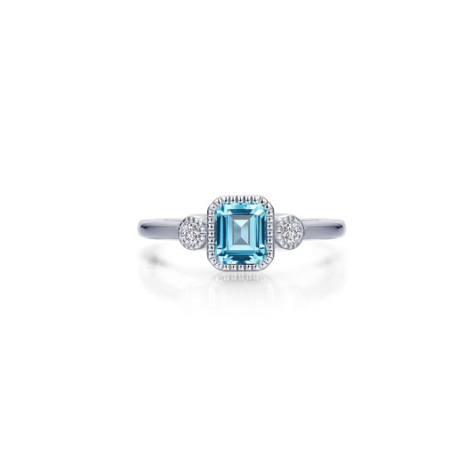 Emerald-cut aquamarine ring with diamond accents.