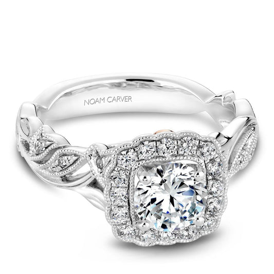 Floral halo diamond ring in white gold.