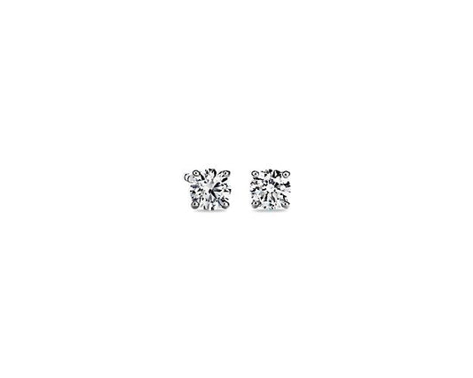 Round diamond studs in white gold setting.