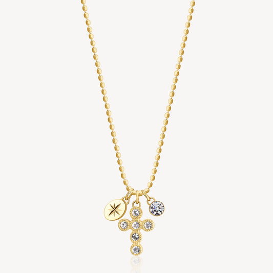 Yellow cross necklace with simulated diamonds.