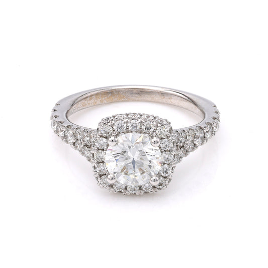 Halo diamond ring in 18K white gold.