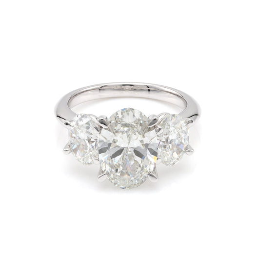 Three-stone oval diamond white gold ring.