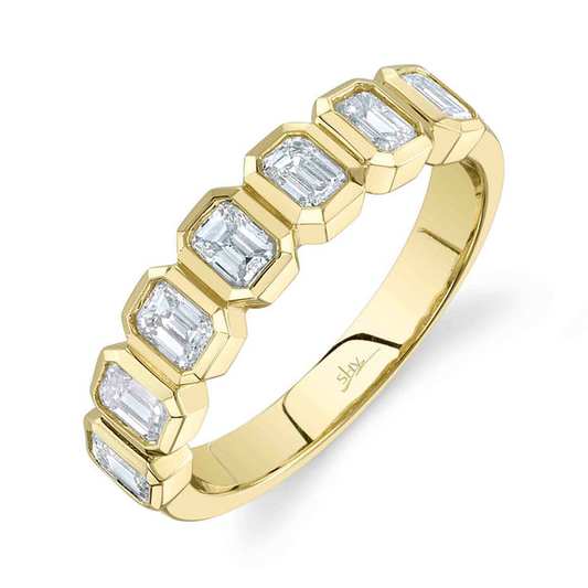 Yellow gold band with emerald-cut diamonds.