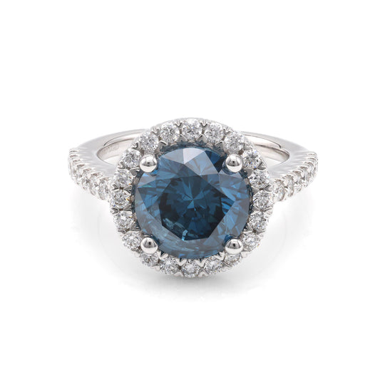 Blue diamond halo engagement ring.