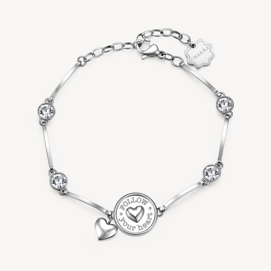 Heart charm bracelet with simulated diamonds.