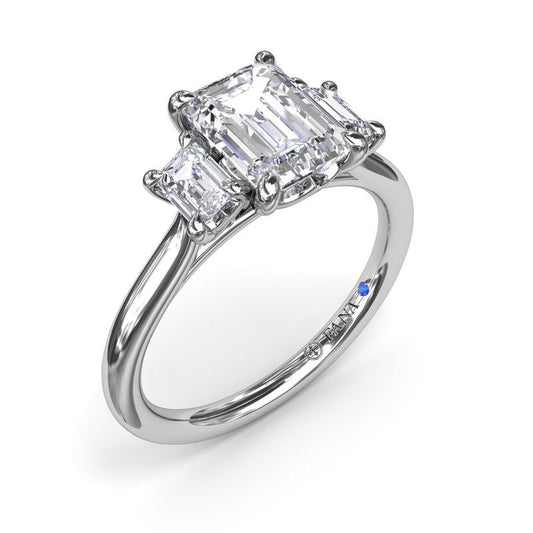 Emerald-cut diamond ring, three-stone design.