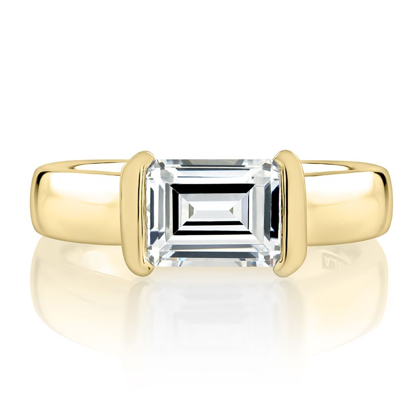 Emerald-cut diamond, yellow gold solitaire ring.