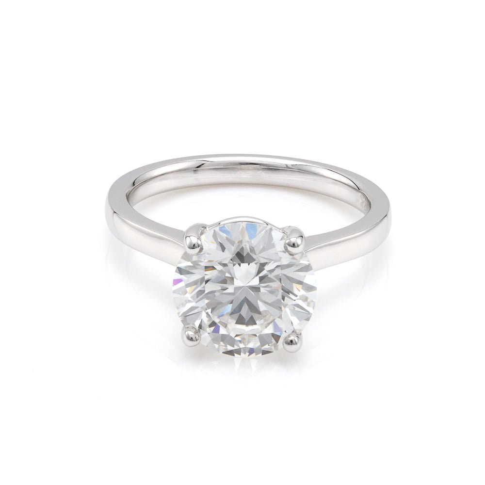 18K white gold ring with round diamond.