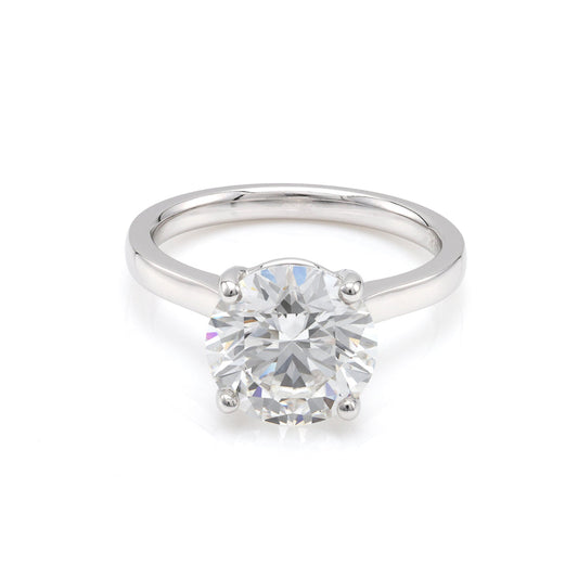 18K white gold ring with round diamond.