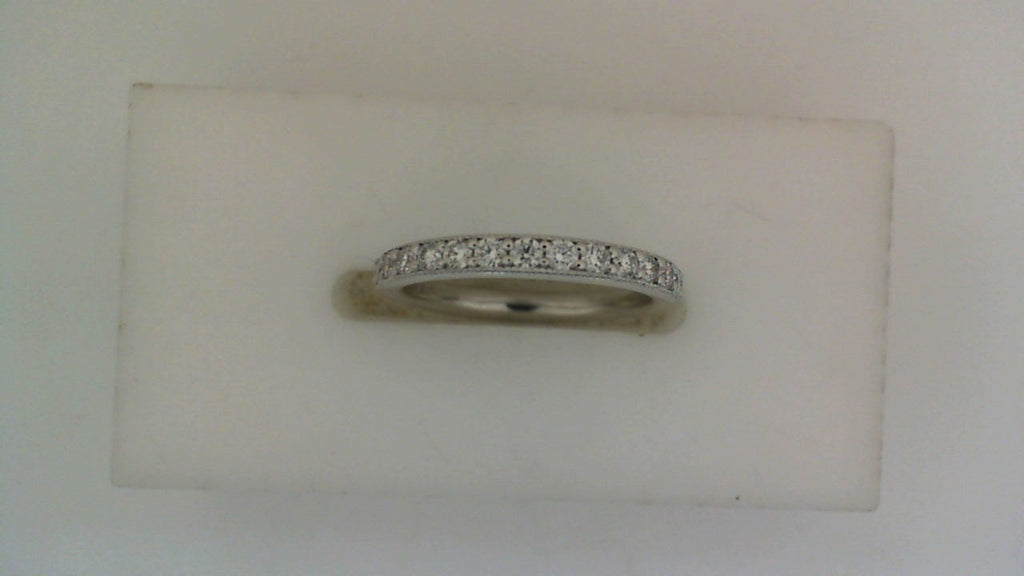 14K white gold band with round diamonds.