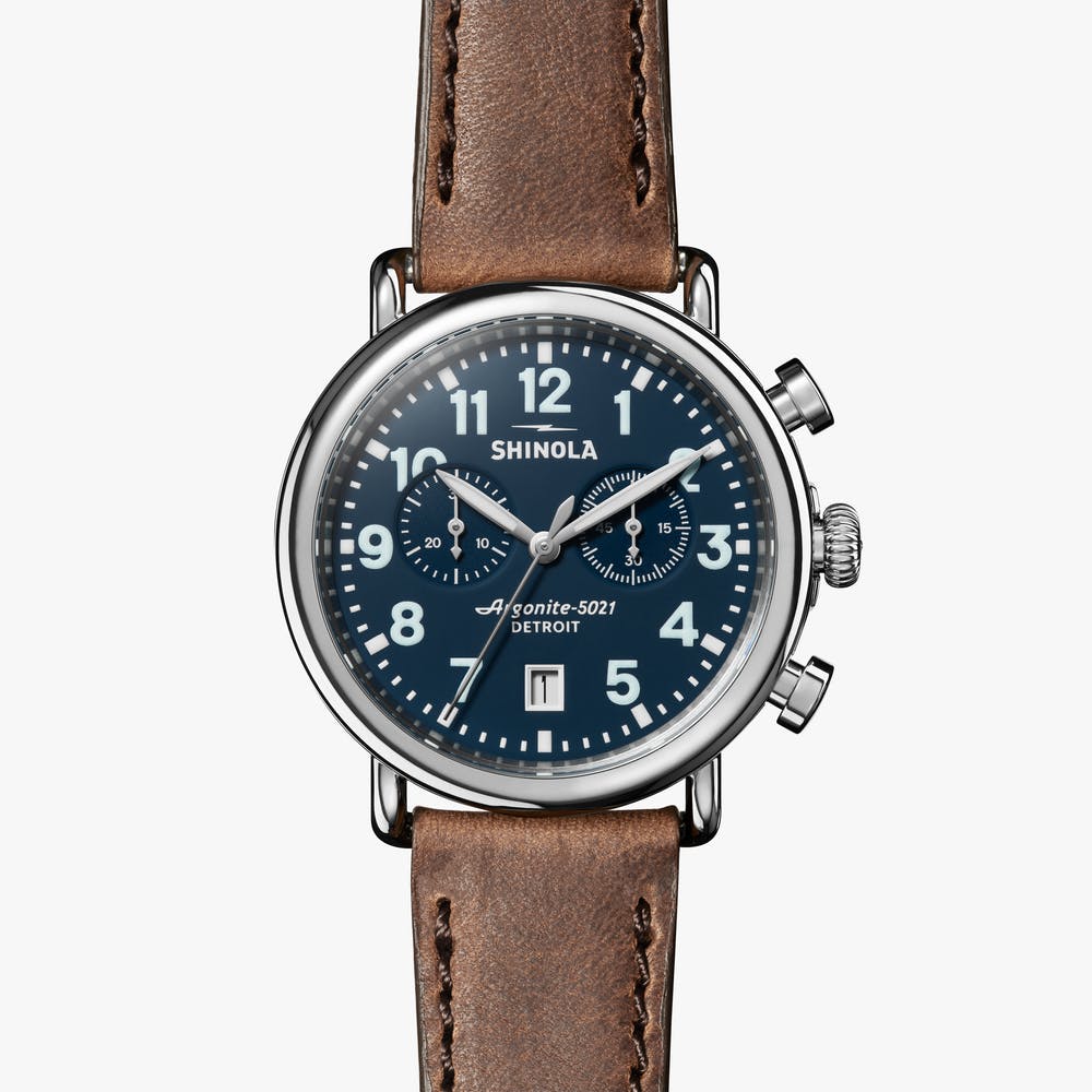 Blue dial chronograph with brown leather strap.