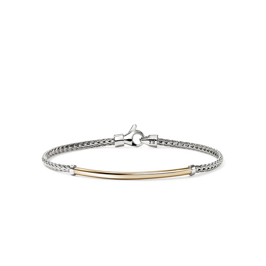Sterling silver bracelet with yellow gold accent.