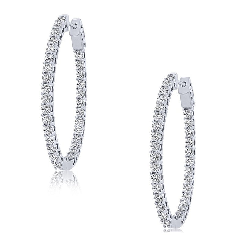 Oval white gold hoops with round diamonds.