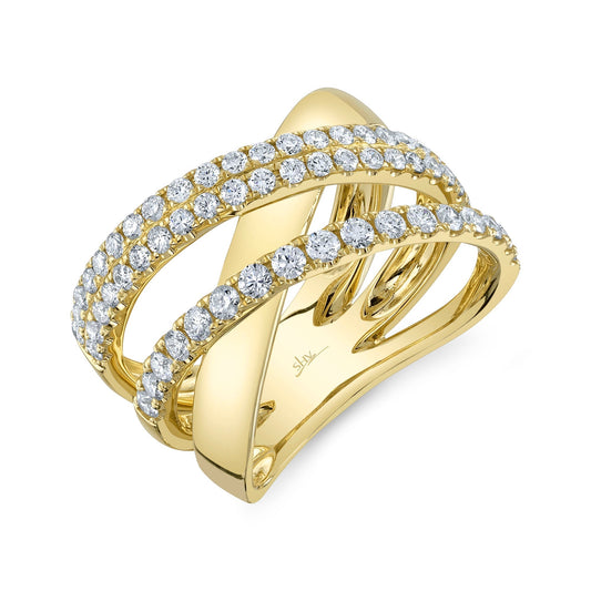 Diamond-studded yellow gold crossover ring.