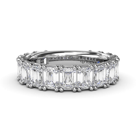 14K white gold band with emerald-cut diamonds.