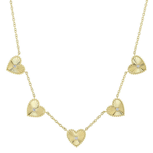 Heart-shaped yellow gold necklace with diamonds.
