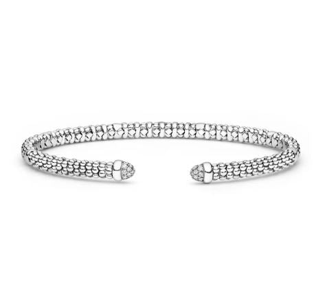 Sterling silver bangle with diamond accents.