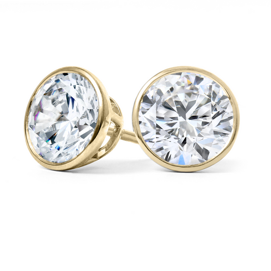 Lab-grown diamond studs in yellow gold.