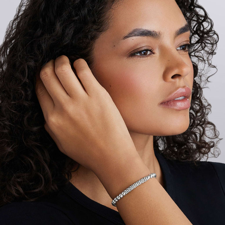 Sterling silver stretch bracelet on wrist.