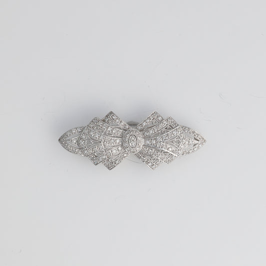 14k white gold bow pin with diamonds.